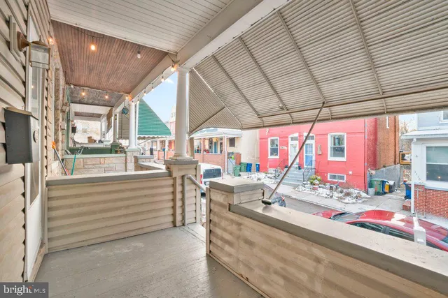 a view of patio with a table and chairs and couches