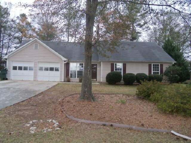 2415 Turner Road Southwest Conyers, GA 30094 - Photo 1 of 1 a view of a house with a yard plants and large tree