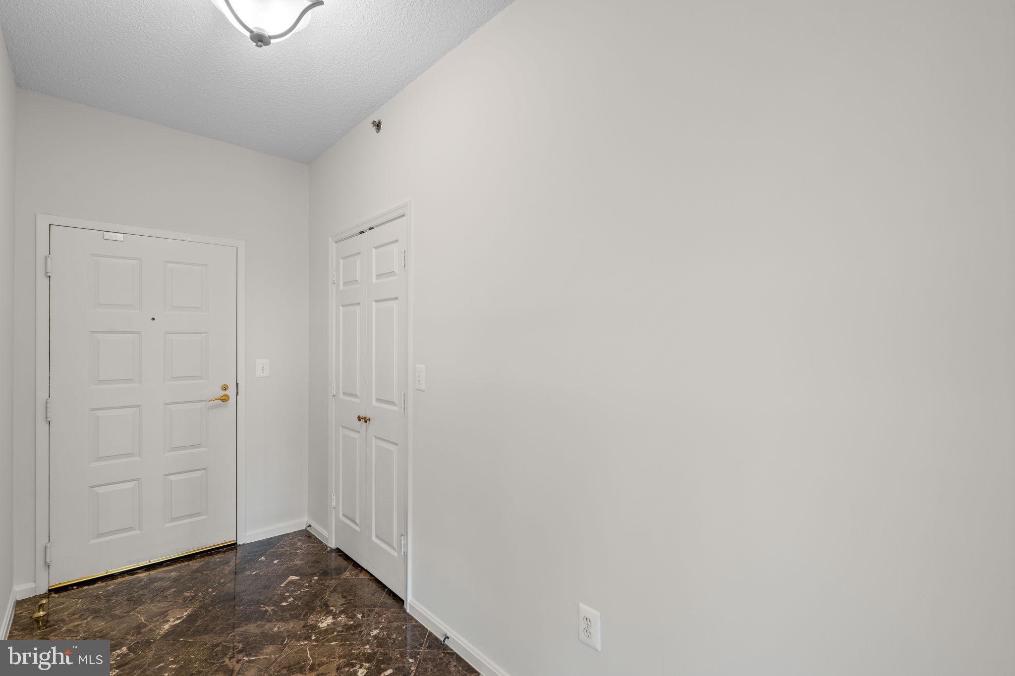3210 North Leisure World Boulevard, Unit 1001 Silver Spring, MD 20906 - Photo 6 of 47 Foyer with large walk-in closet