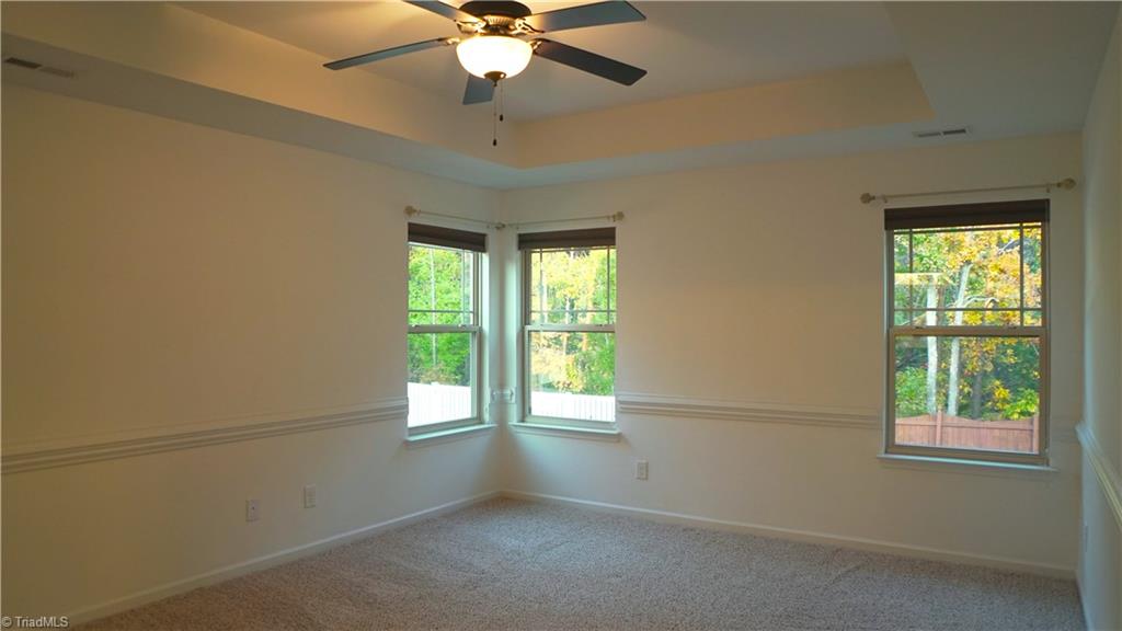 4626 White Beard Road High Point, NC 27265 - Photo 9 of 23 Master Bedroom with Tray Ceiling and Ceiling Fan