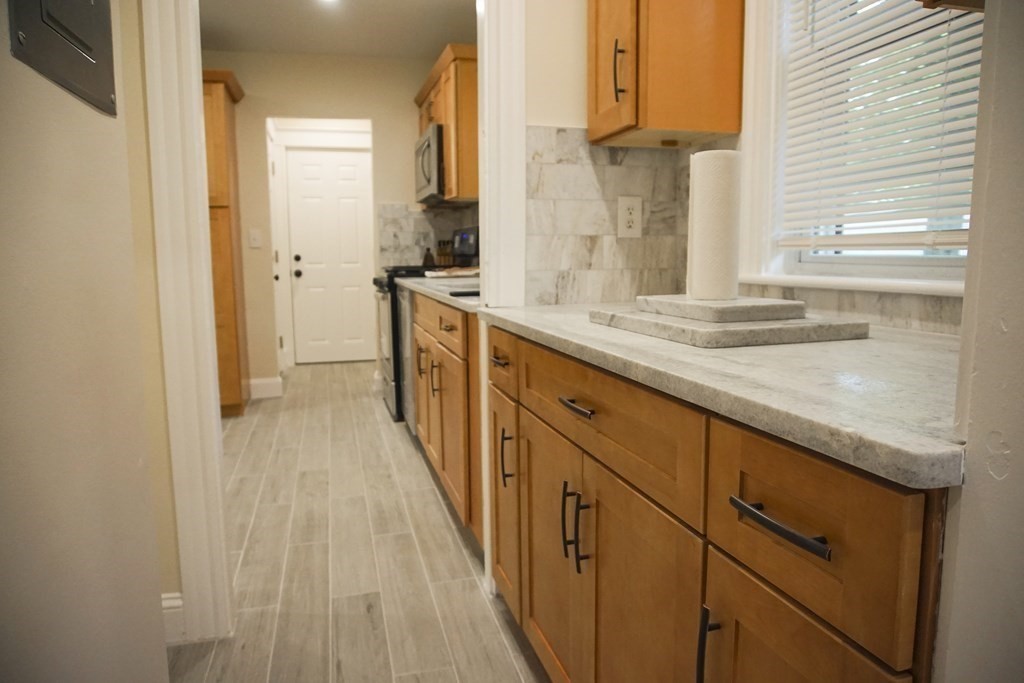 16 Ogden Street, Unit 16 Boston, MA 02124 - Photo 7 of 9 a view of a kitchen and utility room