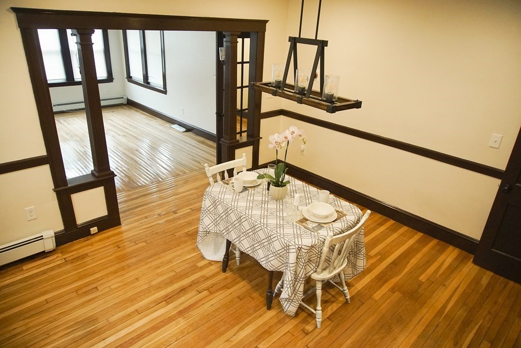 16 Ogden Street, Unit 16 Boston, MA 02124 - Photo 9 of 9 a view of a living room with furniture and wooden floor