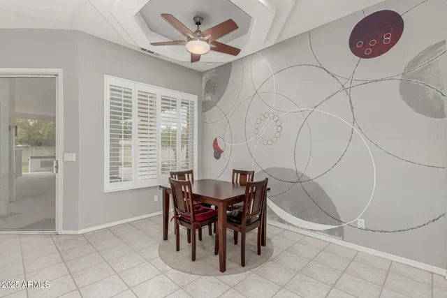 a view of a swimming pool with a patio and a yard