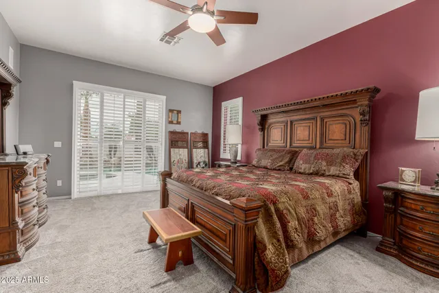 a view of a backyard with a tub and palm trees