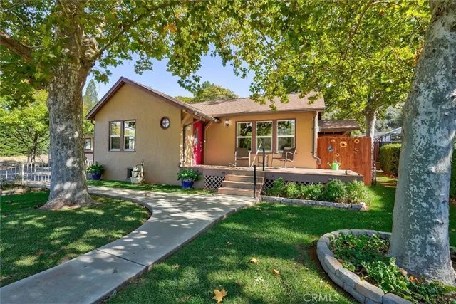 a front view of a house with garden