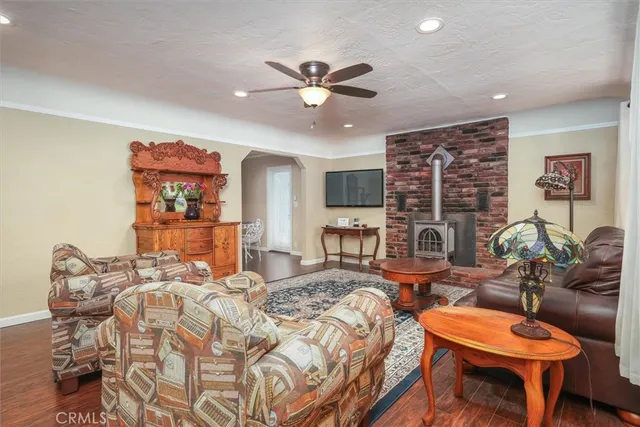 a bedroom with furniture and a large window