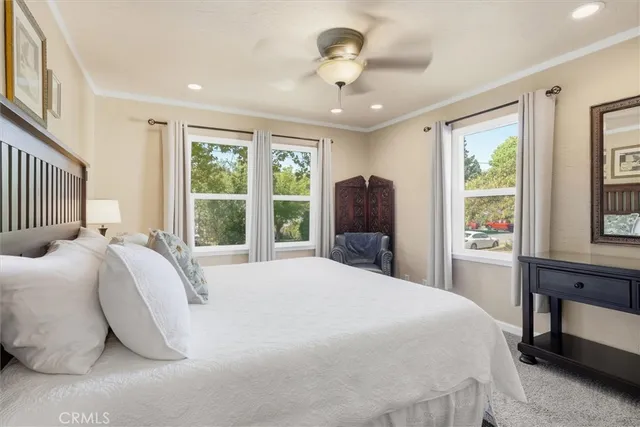 a bedroom with a large bed and a window