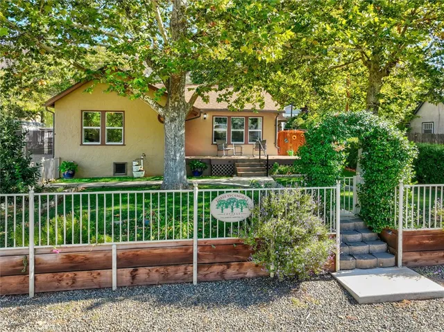 a view of a yard with a house and a garden