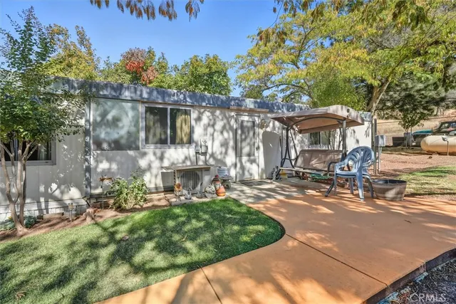 a kitchen with stainless steel appliances granite countertop a sink and a refrigerator