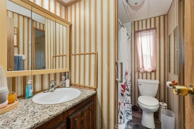 a view of a backyard with large trees