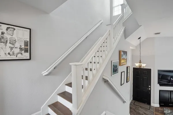 a view of a hallway with entryway door