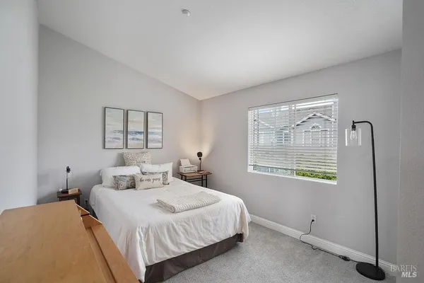 a bedroom with a bed and couch