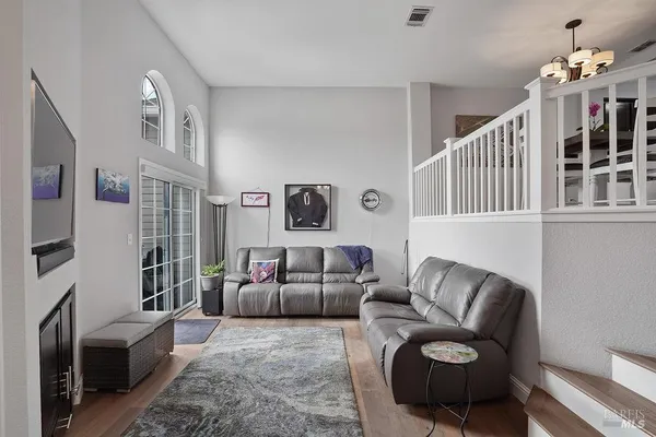 a living room with furniture fireplace and a couch