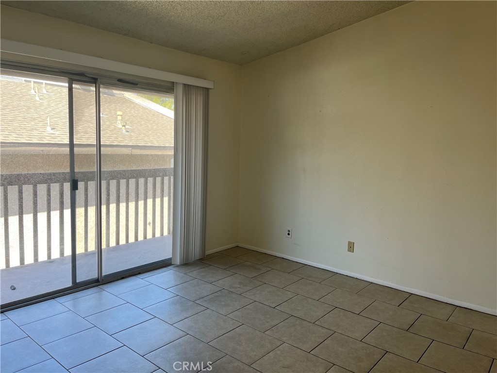 1251 South Meadow Lane Colton, CA 92324 - Photo 4 of 10 a view of an empty room and window
