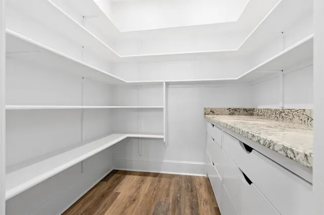 a view of storage and utility room with empty racks