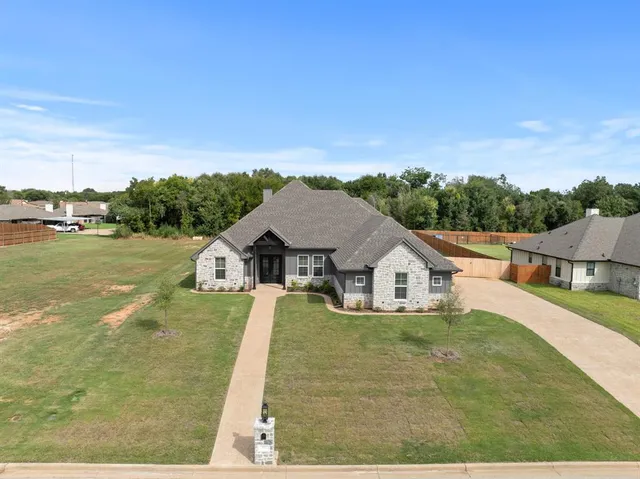 a view of a house with a big yard