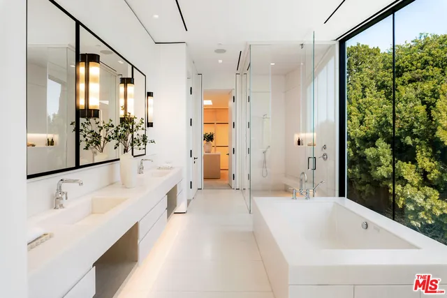 a bathroom with a shower and a sink