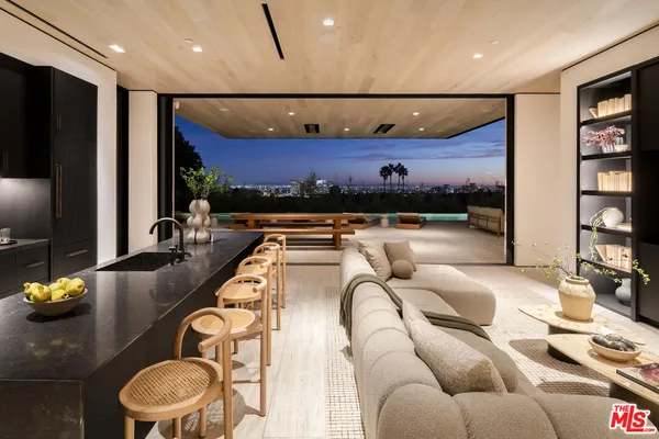a balcony with table and chairs