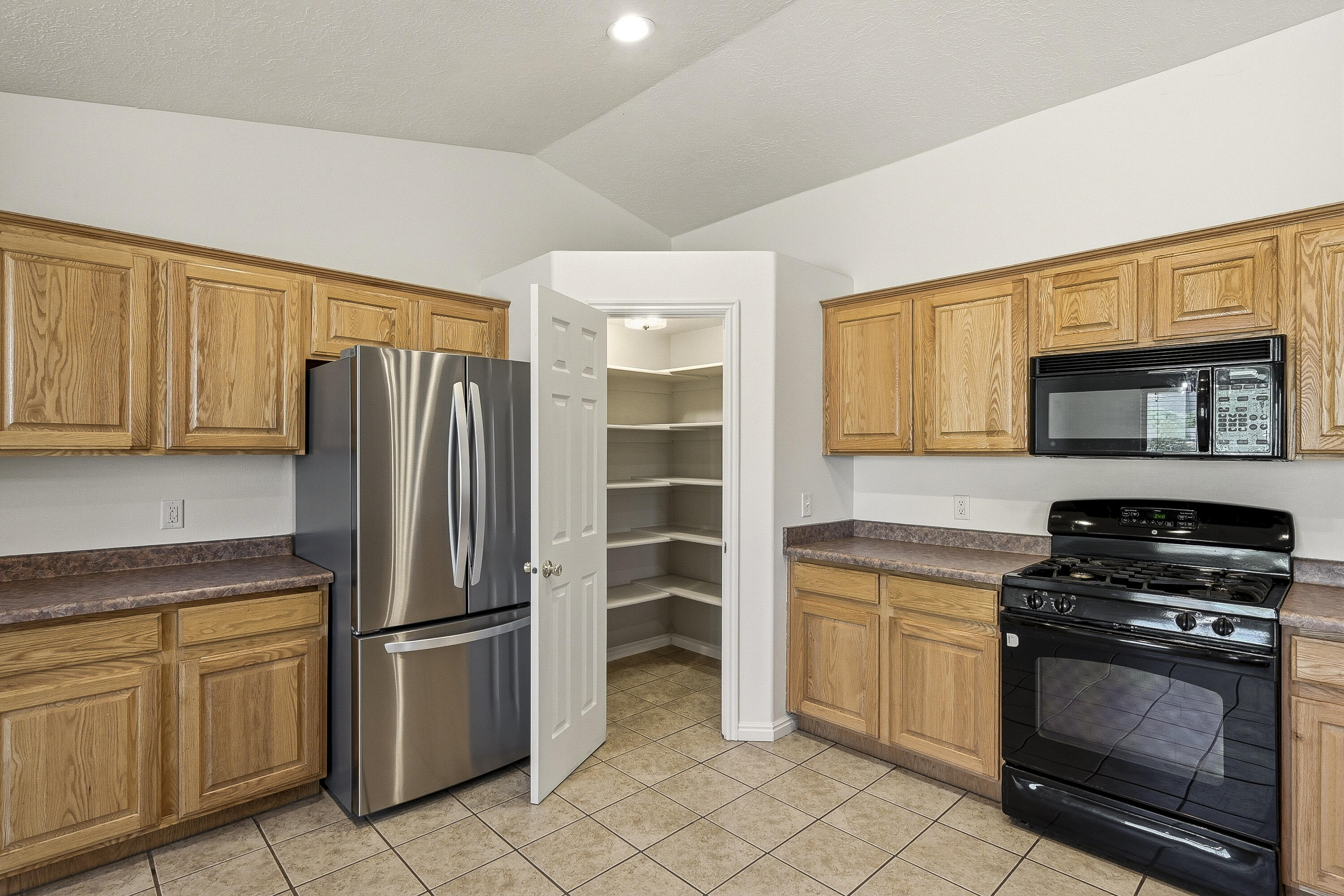 4510 North Half Mile Road Cedar City, UT 84721 - Photo 14 of 48 The corner pantry is a convenient and practical storage solution for kitchen essentials.
