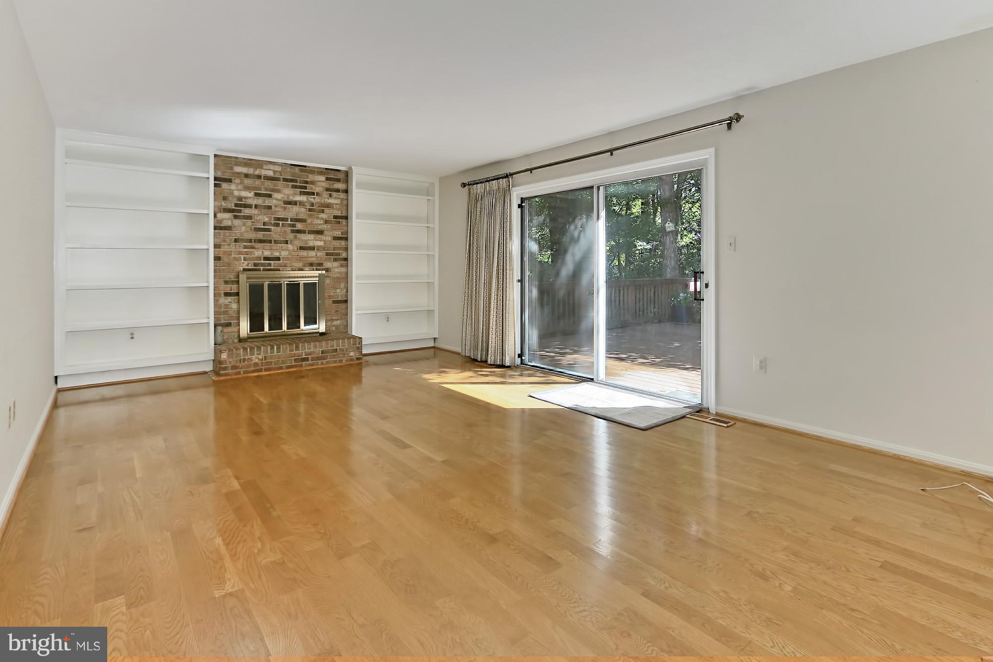 Family Rm w/ hardwoods, fireplace  & built-ins