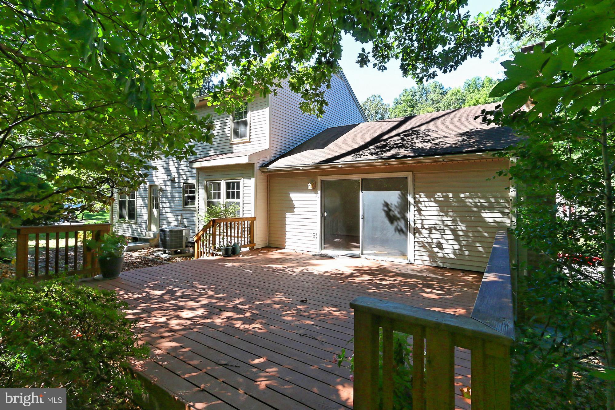 9849 Natick Road Burke, VA 22015 - Photo 24 of 29 View of deck from backyard
