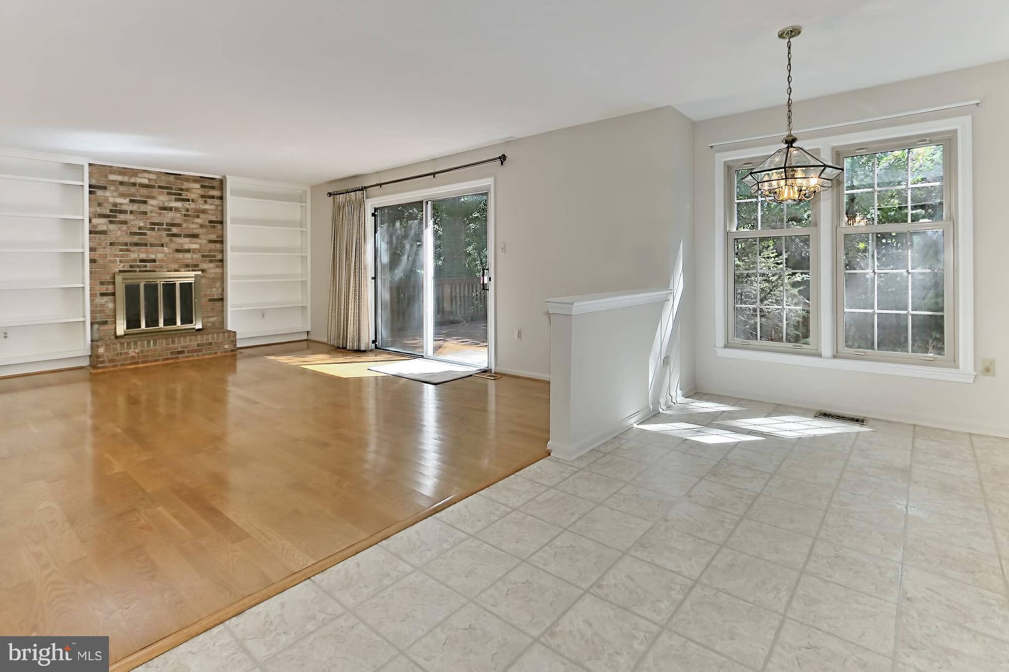 A breakfast area is highlighted by large windows