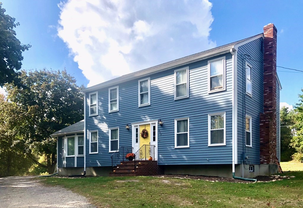 889 Upper Union Street Franklin, MA 02038 - Photo 1 of 42 front view of a house with a yard