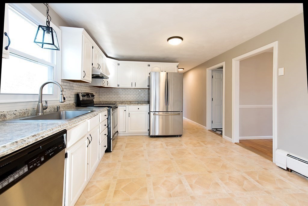 889 Upper Union Street Franklin, MA 02038 - Photo 19 of 42 a kitchen with refrigerator cabinets and a sink
