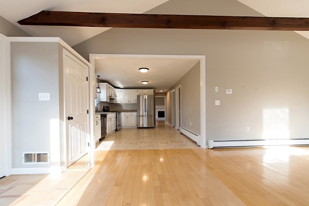 889 Upper Union Street Franklin, MA 02038 - Photo 25 of 42 a view of a hallway with a living room