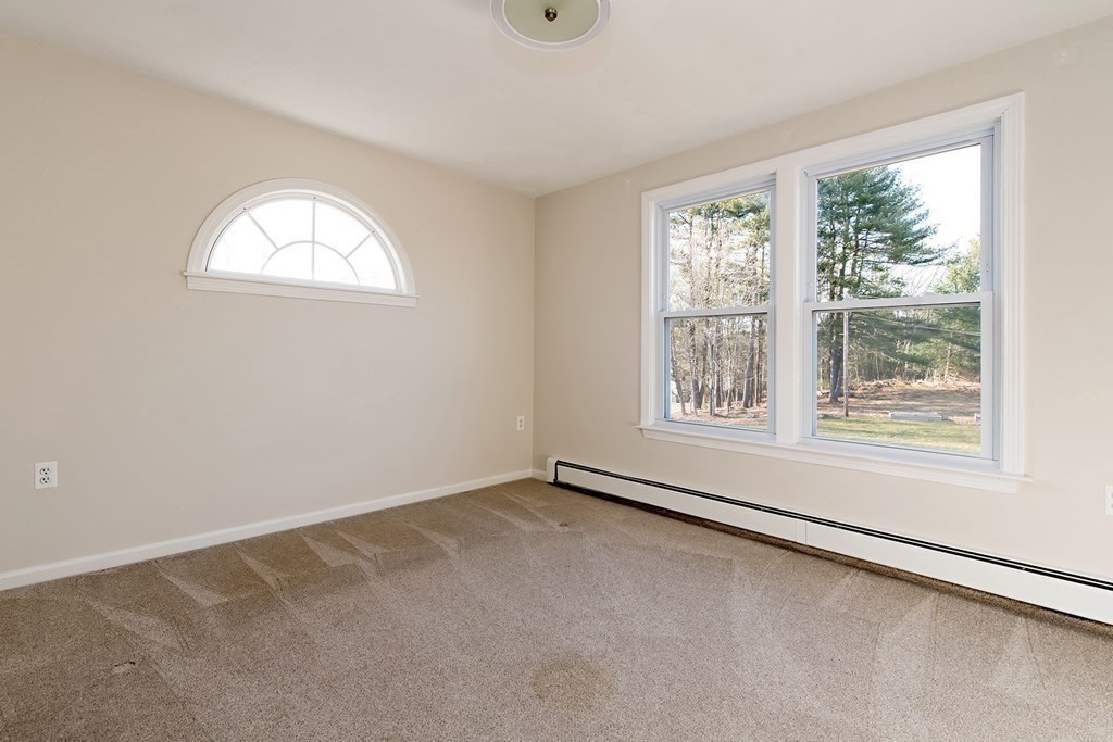 889 Upper Union Street Franklin, MA 02038 - Photo 29 of 42 an empty room with a window