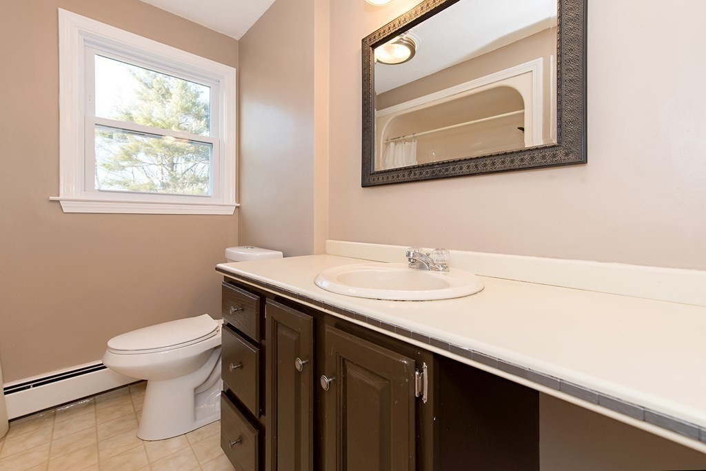 889 Upper Union Street Franklin, MA 02038 - Photo 31 of 42 a bathroom with a sink and a toilet