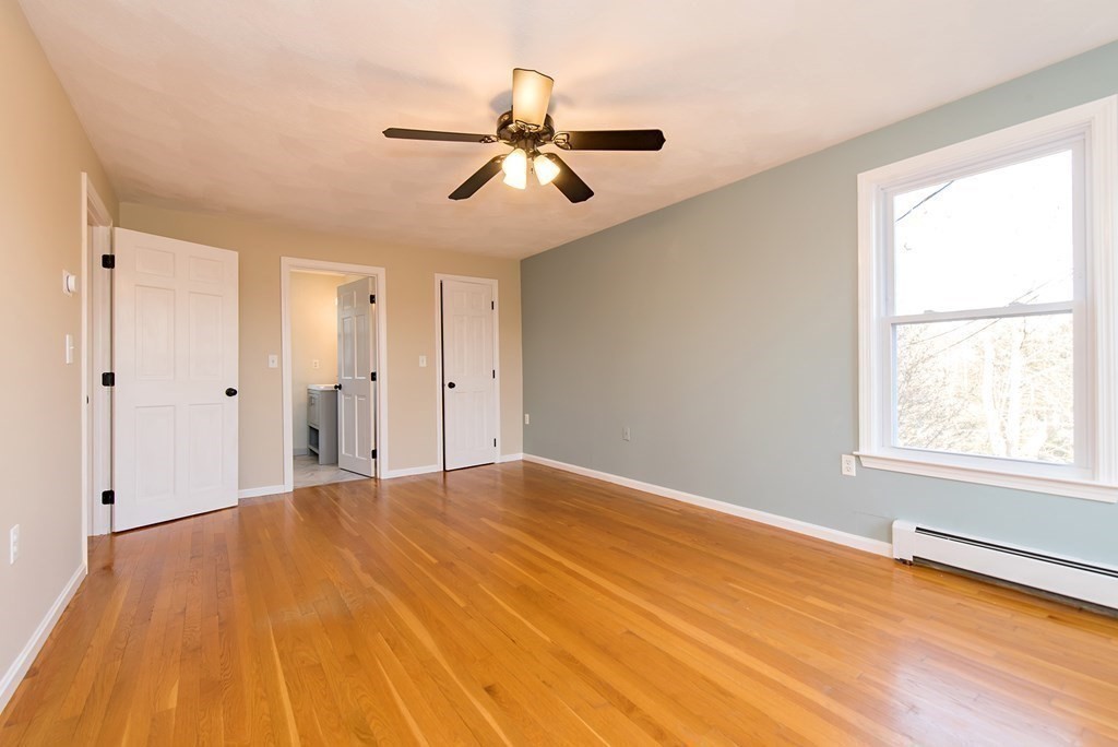 889 Upper Union Street Franklin, MA 02038 - Photo 33 of 42 a view of empty room with wooden floor and fan