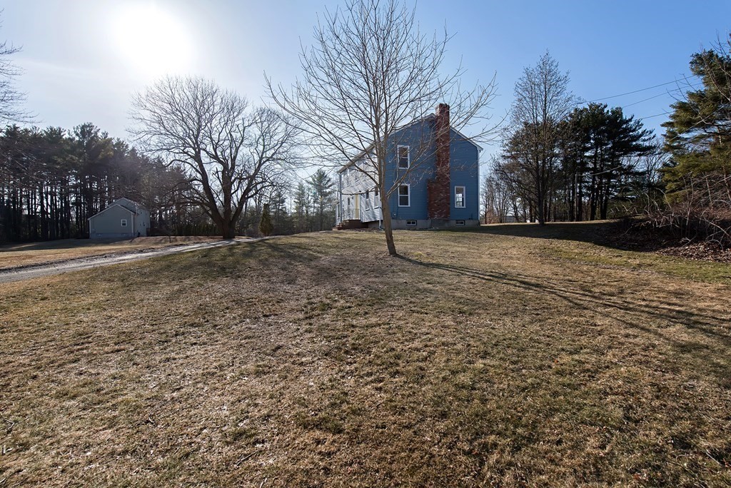 889 Upper Union Street Franklin, MA 02038 - Photo 4 of 42 a backyard of a house