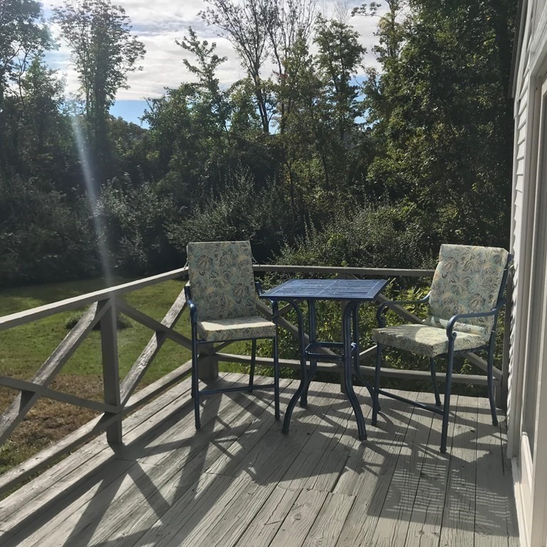 889 Upper Union Street Franklin, MA 02038 - Photo 41 of 42 a view of backyard with outdoor seating and trees