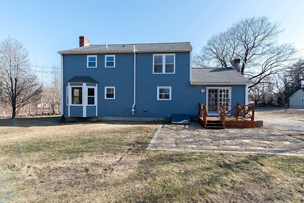 889 Upper Union Street Franklin, MA 02038 - Photo 5 of 42 a view of a house with a patio