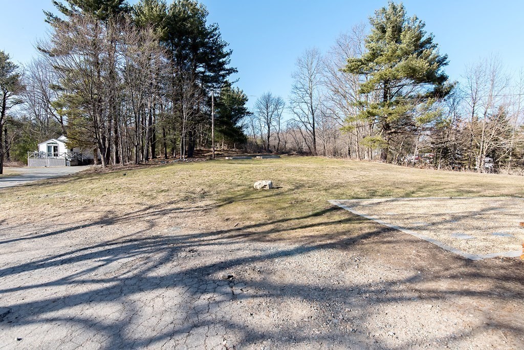 889 Upper Union Street Franklin, MA 02038 - Photo 7 of 42 a view of a yard with large trees