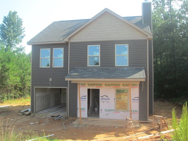 3391 Trotters Ridge Trail Gray, GA 31032 - Photo 1 of 1 a front view of a house with a yard