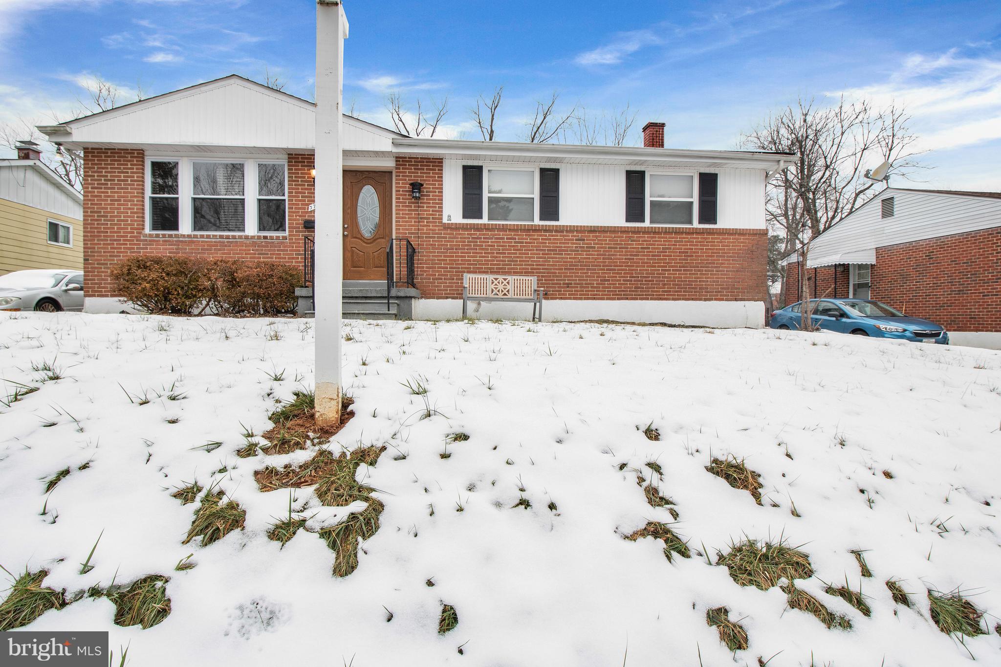 3708 Collier Road Randallstown, MD 21133 - Photo 1 of 25 a front view of a house with a yard