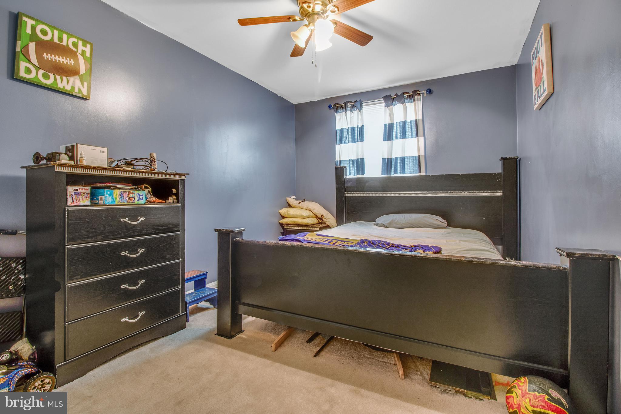 3708 Collier Road Randallstown, MD 21133 - Photo 15 of 25 a bedroom with a bed and a chandelier