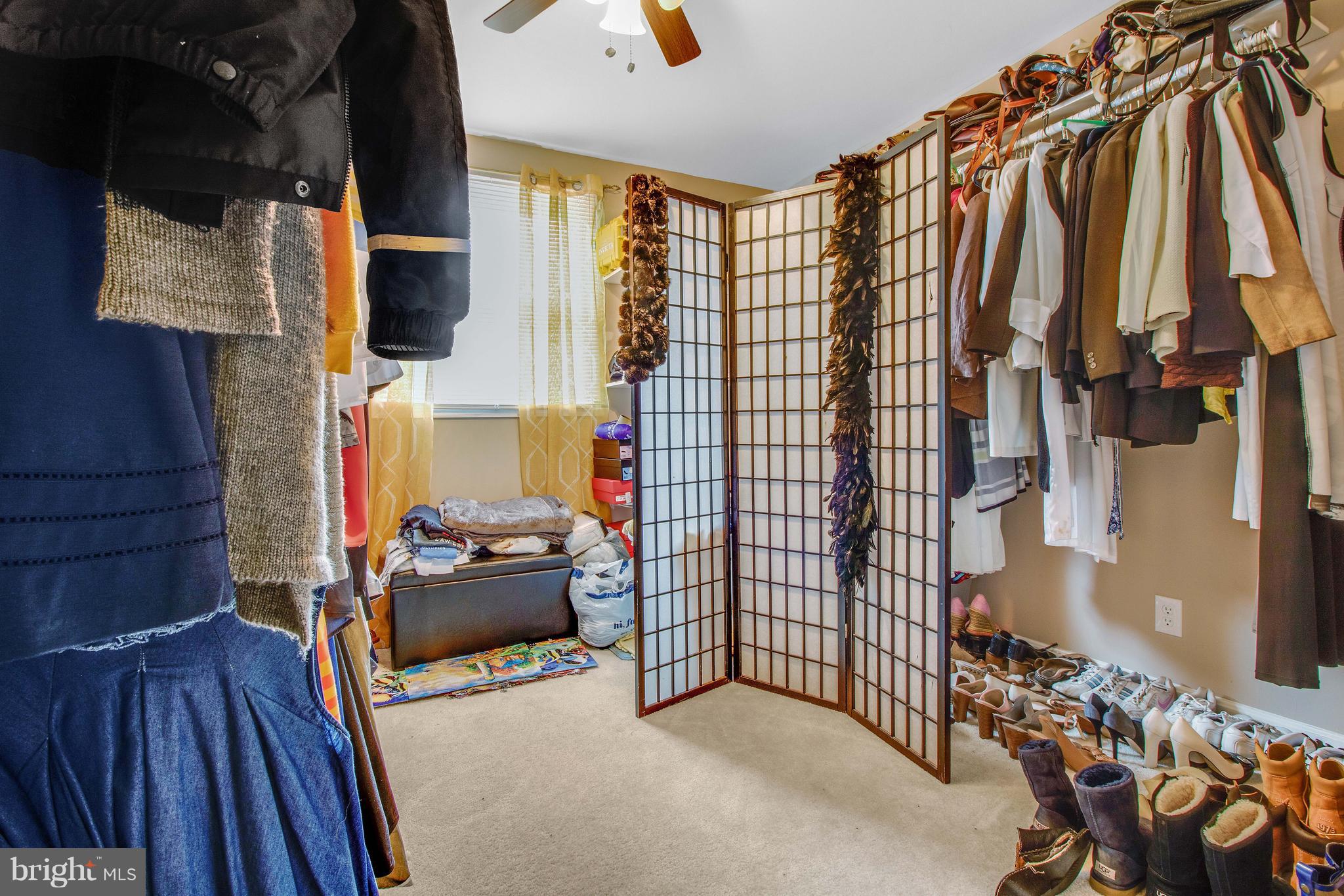 3708 Collier Road Randallstown, MD 21133 - Photo 16 of 25 a view of walk in closet with clothes and shoes