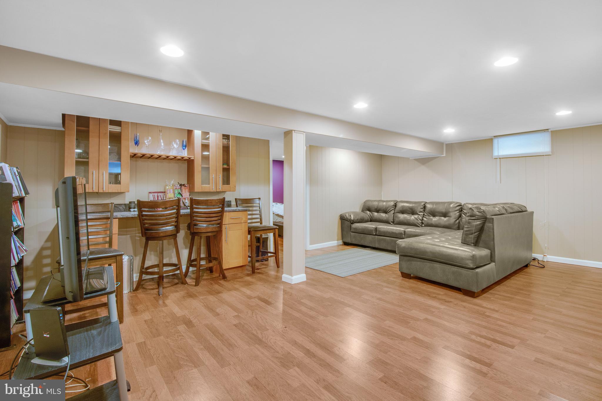 3708 Collier Road Randallstown, MD 21133 - Photo 18 of 25 a living room with furniture and a flat screen tv