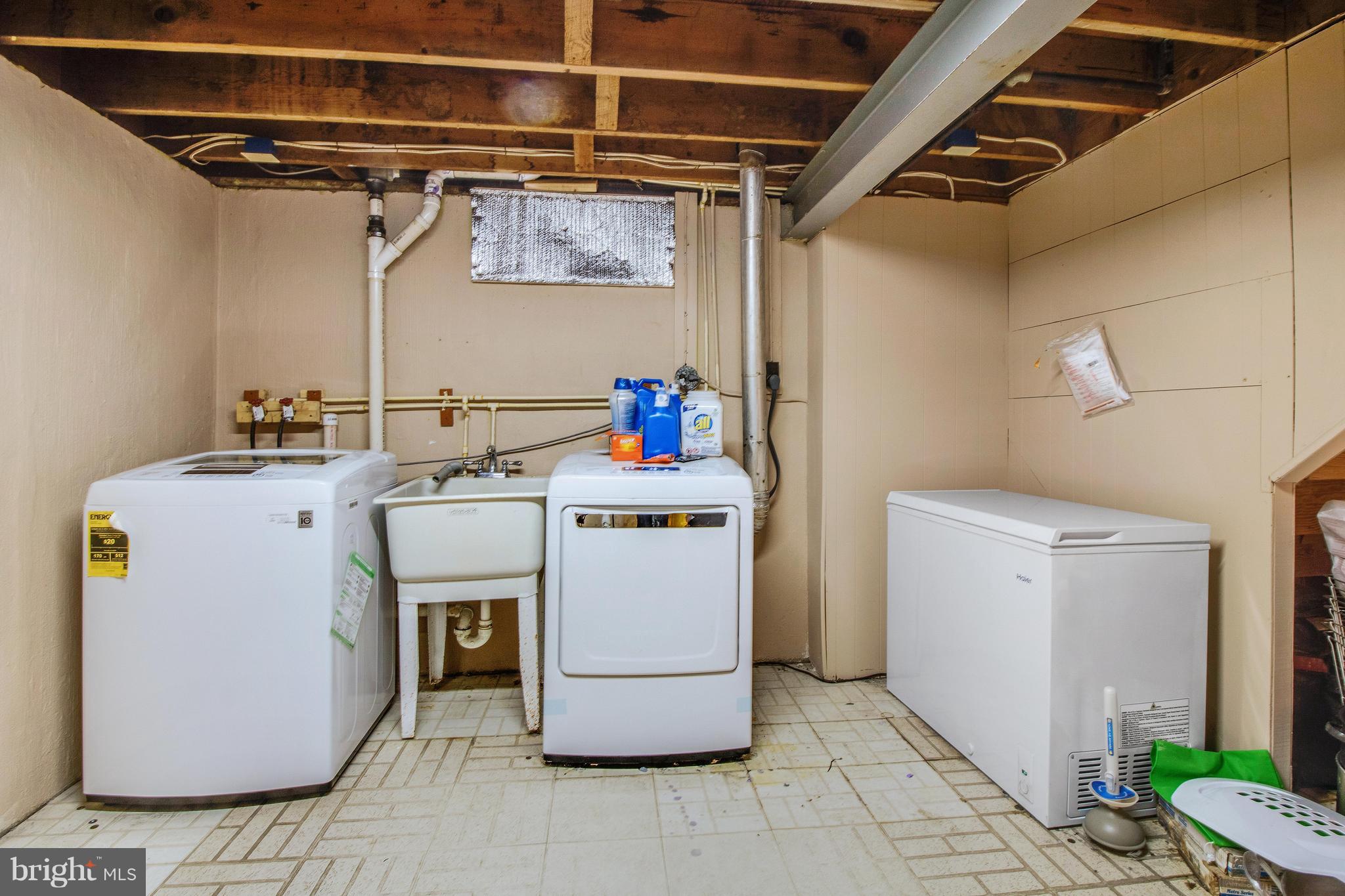 3708 Collier Road Randallstown, MD 21133 - Photo 22 of 25 a utility room with dryer and washer