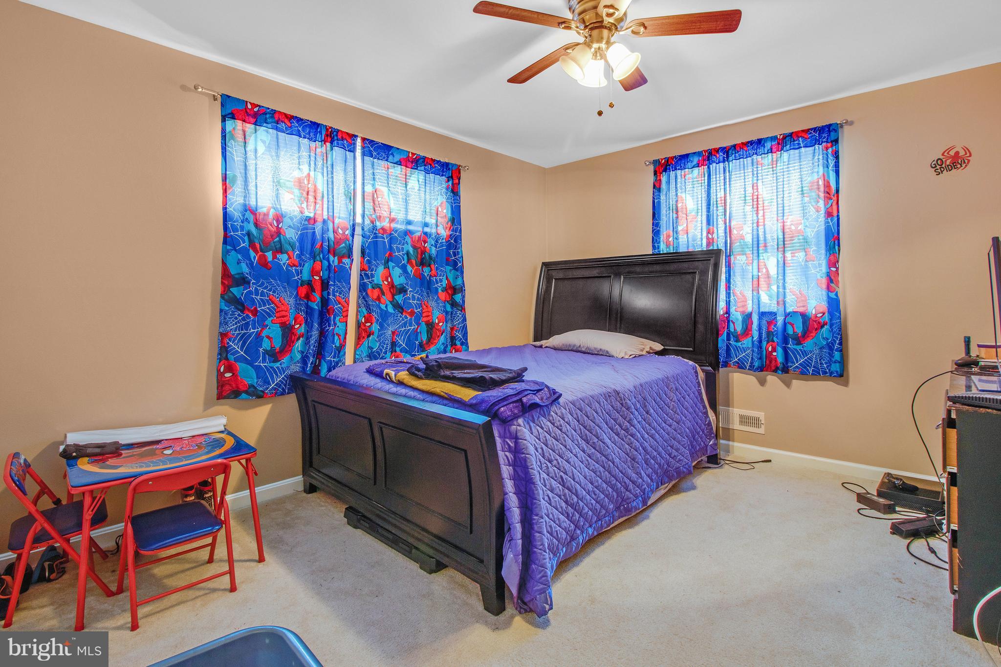 3708 Collier Road Randallstown, MD 21133 - Photo 10 of 25 a bedroom with a bed and a bookshelf