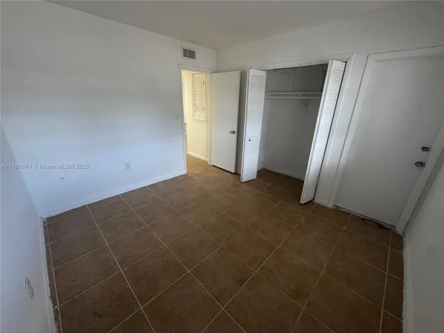 a living room with a couch and a flat screen tv