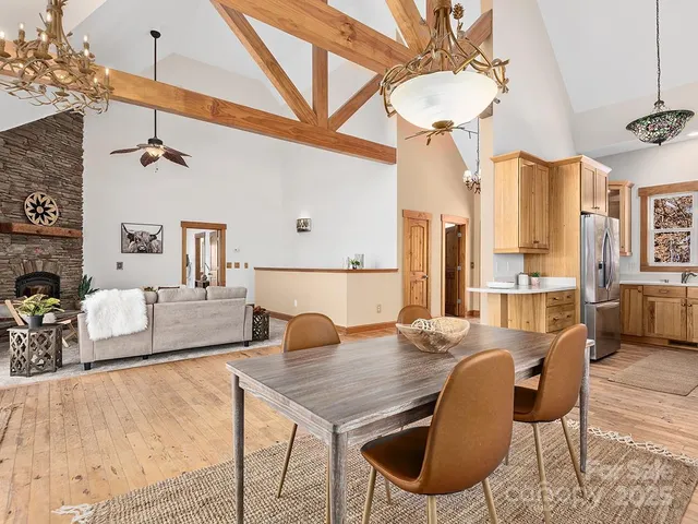 a living room with dining table and a couch