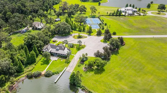 a view of a swimming pool with a yard