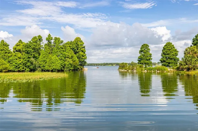 a sign board with yard in the back