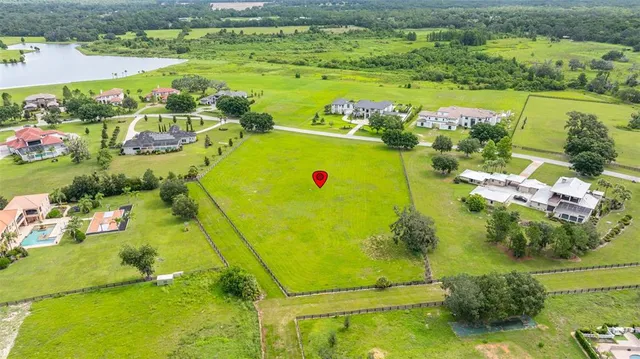 a view of a swimming pool with a yard
