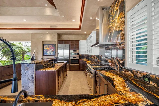 a room with pool table and windows