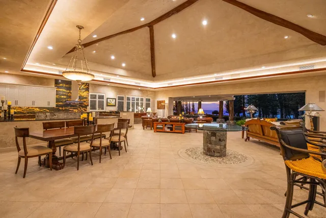 a room with furniture and large windows